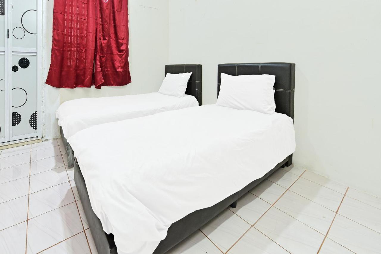 Oyo 90596 Casaria Inn Paka 外观 照片